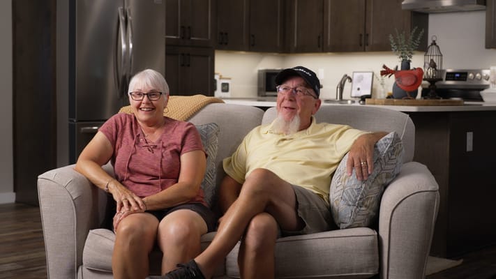 Two residents enjoying their time in a cozy living room