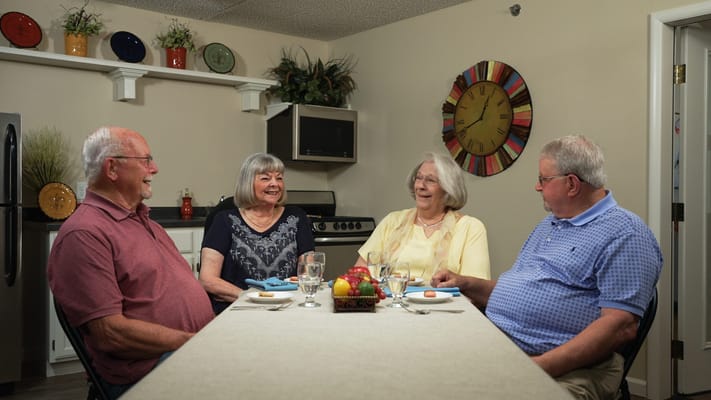 Residents enjoying a meal in a dining area