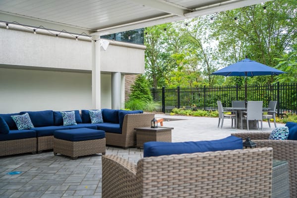 Outdoor seating area with patio and garden