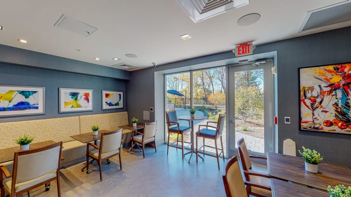 Bright common area with outdoor access and artwork