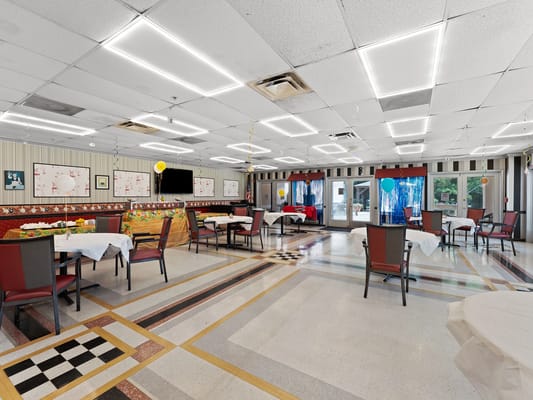 Bright common area with tables and chairs
