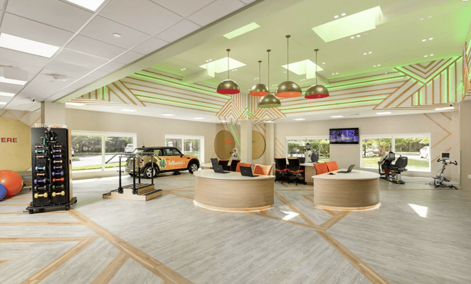 Bright interior view of a modern common area with fitness equipment