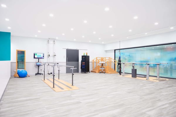 Bright rehabilitation room with exercise equipment