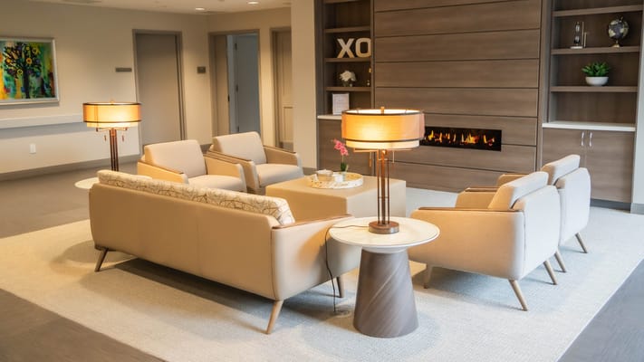 Bright, modern common area with seating and lamps