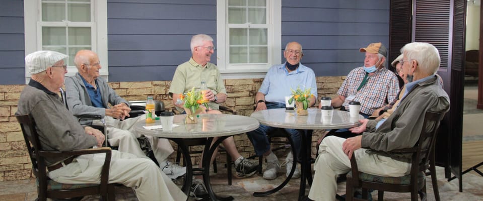 Group of residents enjoying conversation in a common area