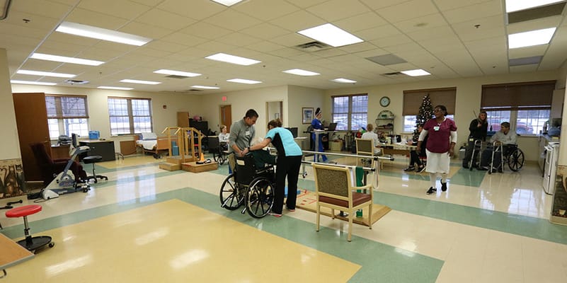Residents participating in a physical therapy session