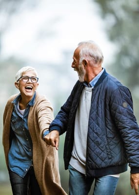 Senior couple enjoying a walk in a garden