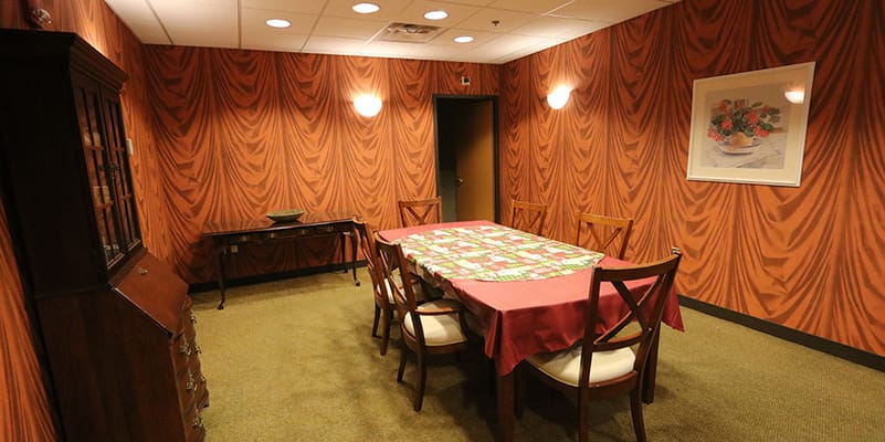 Interior view of a dining room with a table and chairs