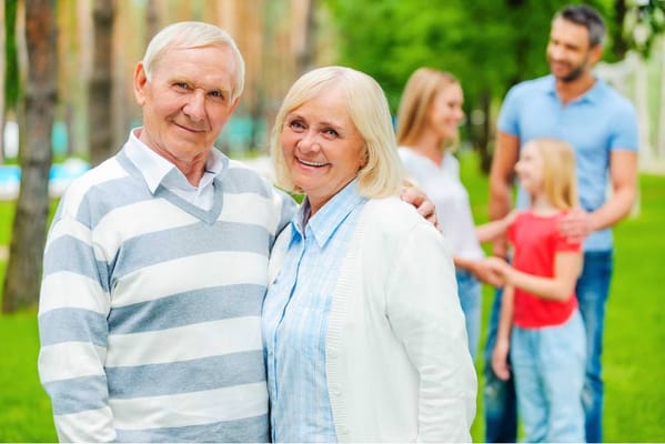 Happy seniors in a garden setting