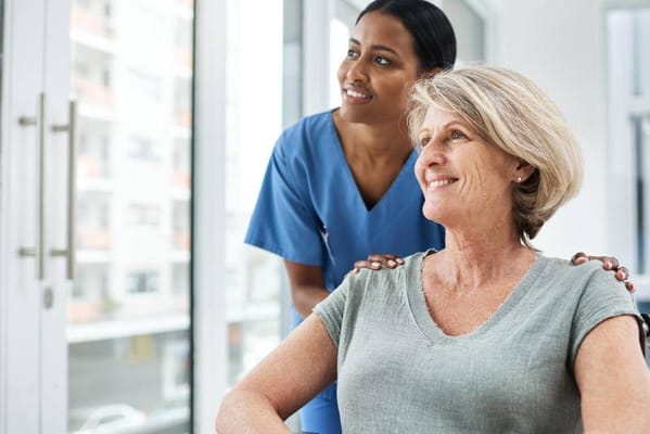 A caregiver and resident enjoying a moment indoors