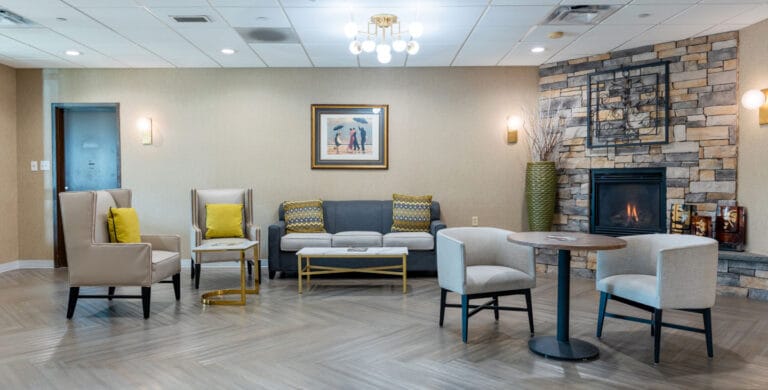 A cozy common area with seating and a fireplace