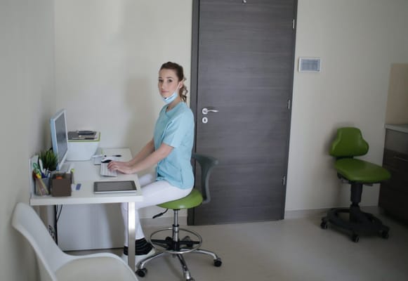 Healthcare staff working at a desk in a facility