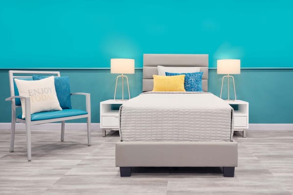 Brightly decorated resident room with modern furniture