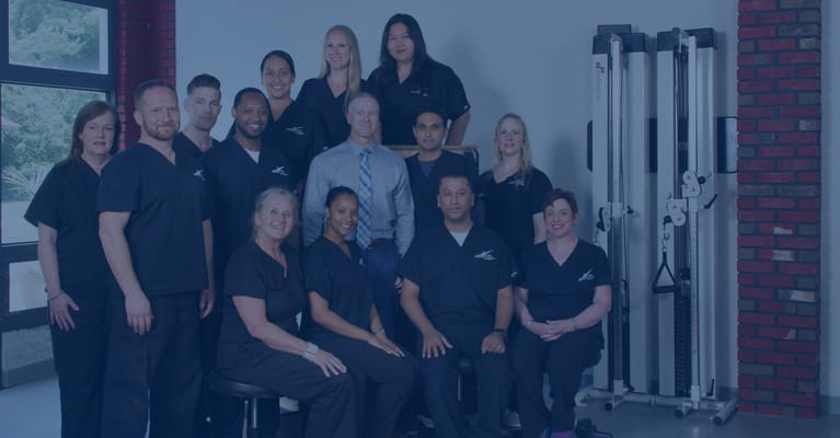 Staff group photo in a facility setting