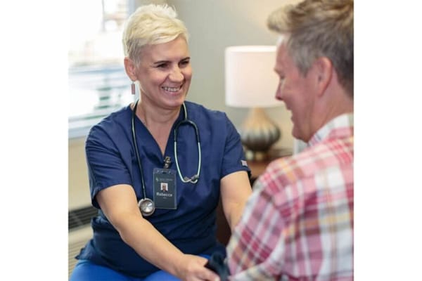 Nurse interacting with a resident in a comfortable setting