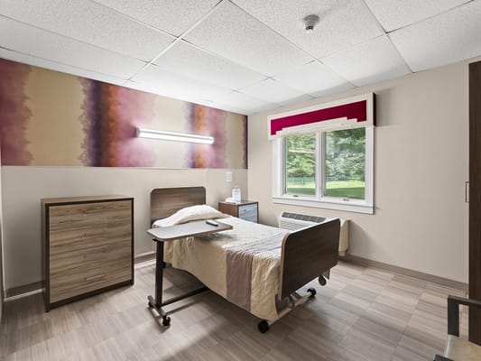 A comfortable resident room with natural light