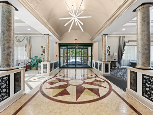 Elegant lobby with decorative flooring and natural light