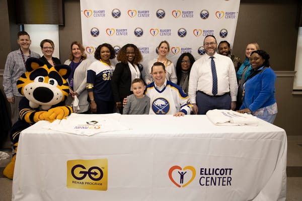 Residents and staff celebrating in a community event