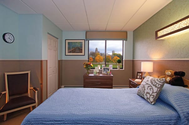 Cozy senior resident room with a view of autumn trees