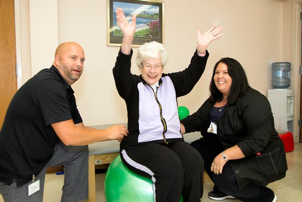 Residents engaging in a fun activity with staff