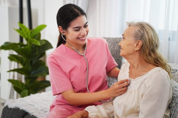 Nurse interacting with a senior resident indoors