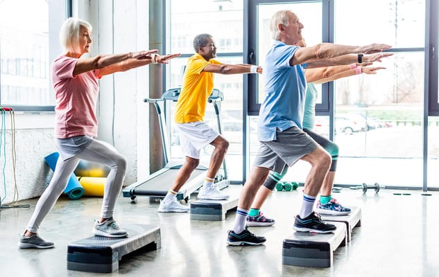 Seniors participating in a group exercise class