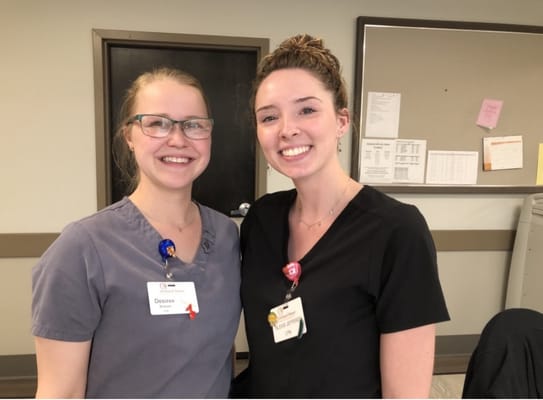 Two smiling staff members in a care facility