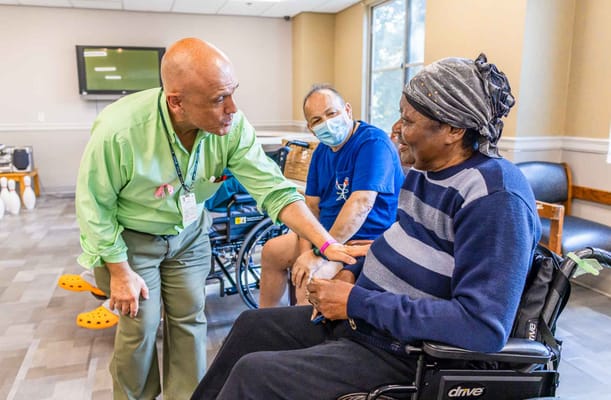 Staff member conversing with a resident in a common area