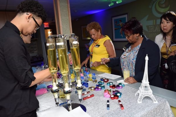 Residents and staff enjoying a social event with drinks