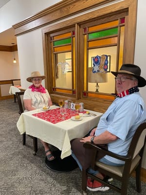 Residents enjoying a festive meal in a dining area