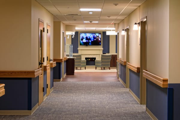 Interior hallway with seating area and TV