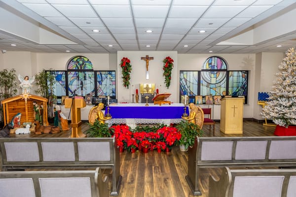 Interior view of a decorated chapel with seating