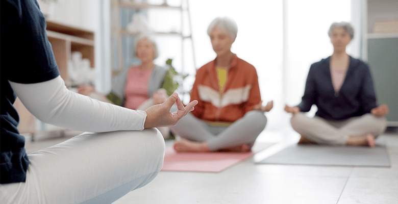 Residents participating in a yoga meditation session