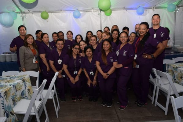 Staff group photo at a celebratory event