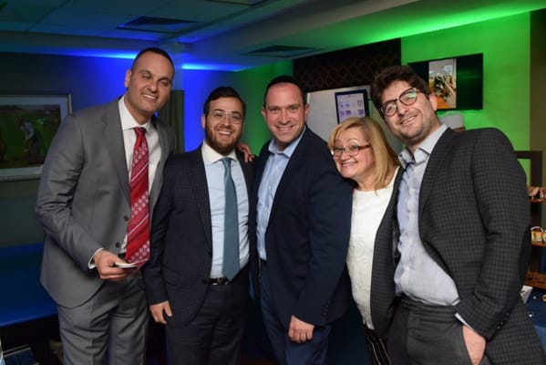 Group of people smiling together at an event