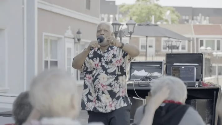 Residents enjoying a live performance outdoors