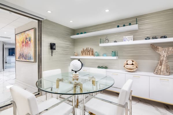 Modern interior common area with glass table and decor