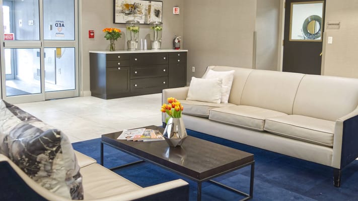 Cozy lobby area with comfortable seating and flowers