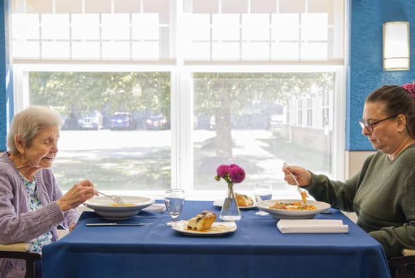 Residents enjoying a meal in the dining room