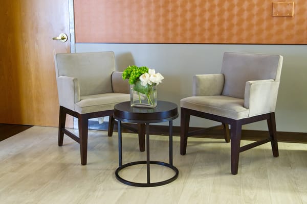 Cozy seating area with chairs and flowers