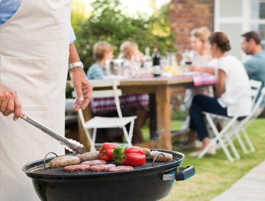 Residents enjoying a barbecue in the garden