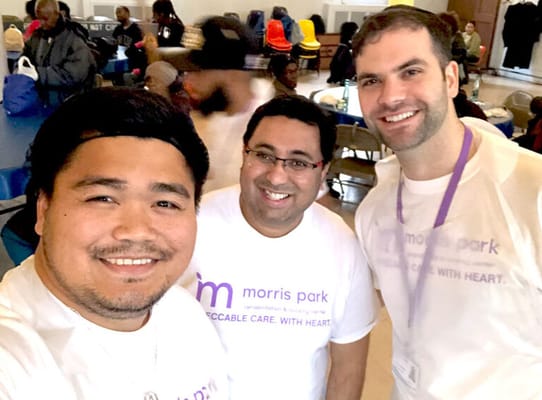 Staff members with residents in a common area