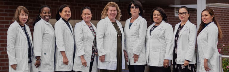 Group of staff members wearing lab coats