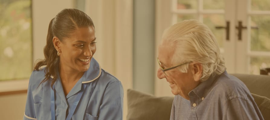 Caregiver interacting with a senior resident