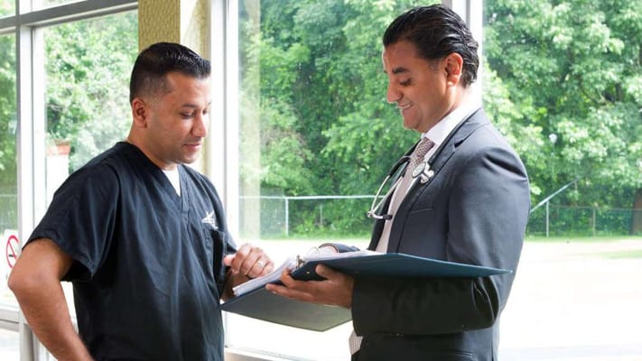 Healthcare professionals discussing patient care indoors