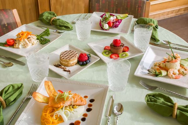Beautifully arranged dining table with gourmet meals