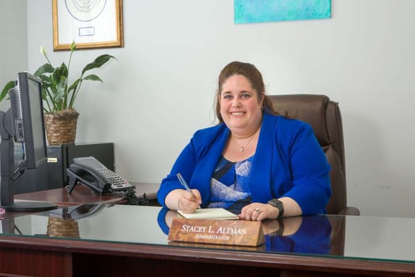 Administrator at a desk in an office setting
