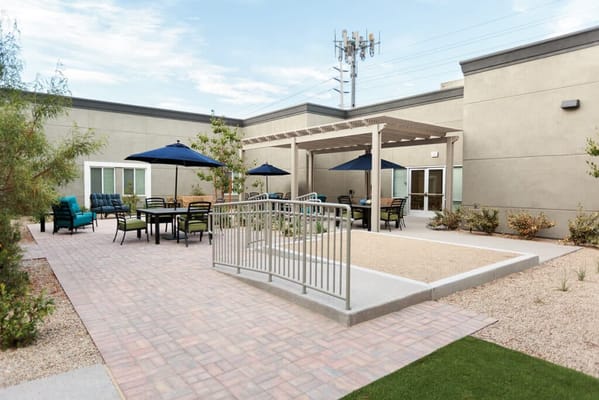 Outdoor gathering area with seating and shade