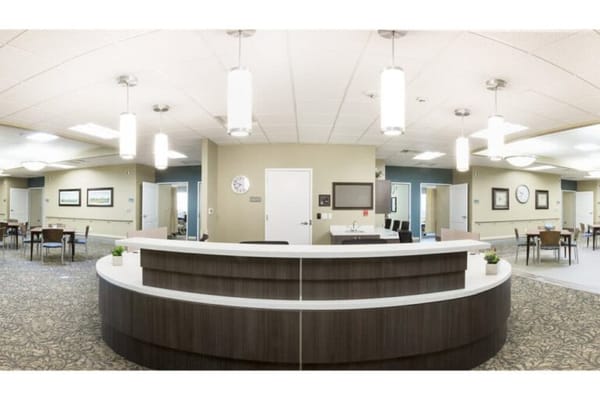 Bright common area with desks and seating