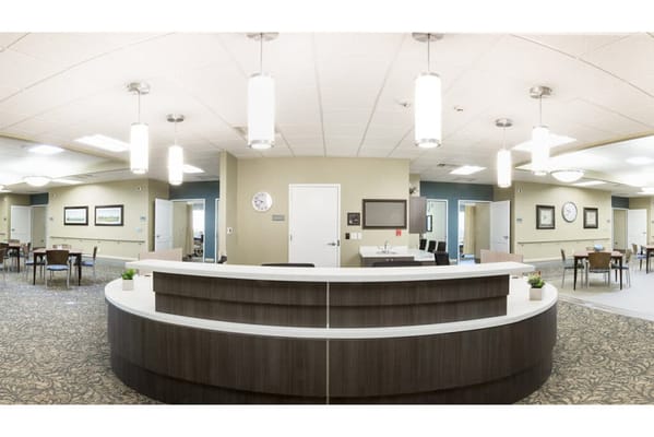 Bright common area with desks and seating